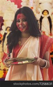Potrait Of A Bengali Married Woman Holding puja Thali