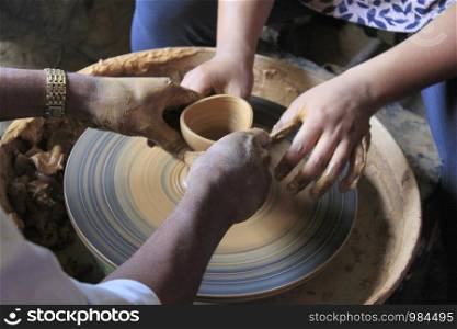 Potter moulding clay to make a pot