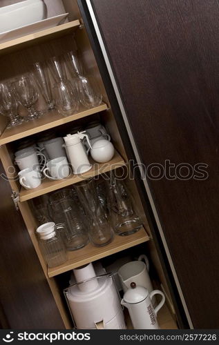 Potteries in a kitchen cabinet