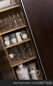 Potteries in a kitchen cabinet