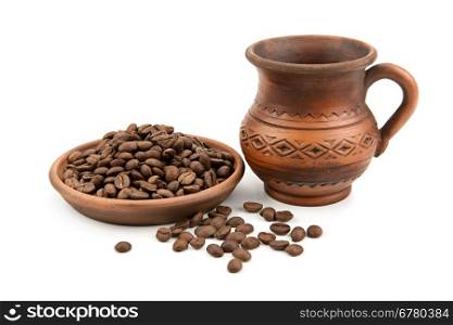 pottery and coffee beans isolated on white background