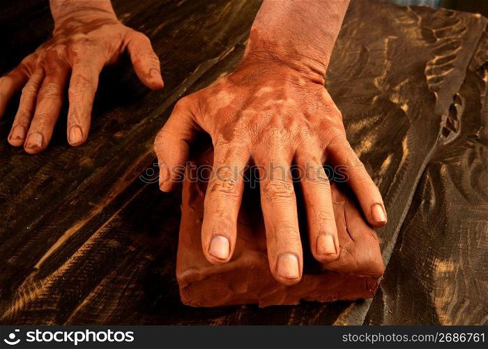 pottery craftmanship potter craftman hands working red clay