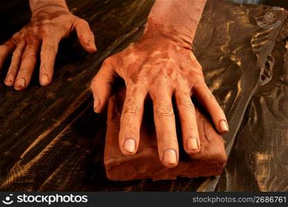 pottery craftmanship potter craftman hands working red clay