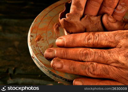 pottery craftmanship red clay potter hands work finger closeup