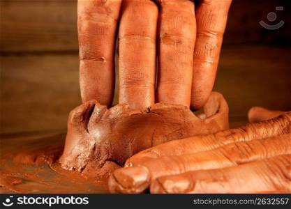 pottery craftmanship red clay potter hands work finger closeup