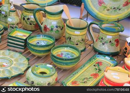 Pottery in many bright colors on a local market in the Provence, France