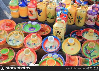 Pottery in traditional Provencal colors and patterns at a market in the Provence