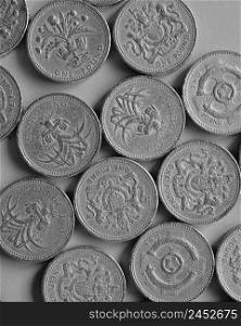 Pound coins money  GBP , currency of United Kingdom - One Pound coin in black and white. One Pound coins, United Kingdom in black and white