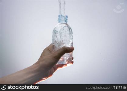 Pour water out of the bottle