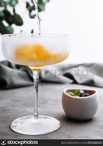 Pouring champagne or prosecco into a glass