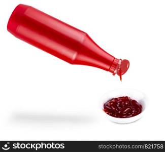 pouring ketchup. from bottle isolated on white background