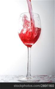 pouring liquid into wineglass