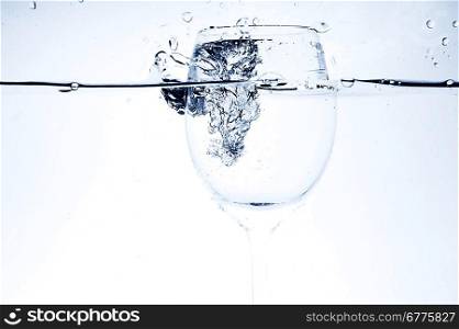 pouring liquid into wineglass close up