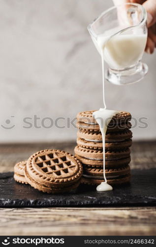 pouring milk chocolate biscuits stack