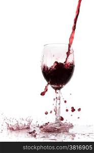 pouring red wine in goblet, isolated on white