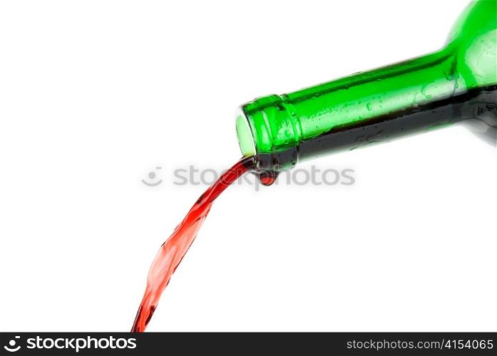 Pouring red wine isolated on white background