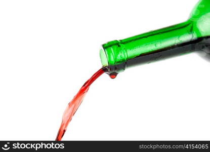 Pouring red wine isolated on white background