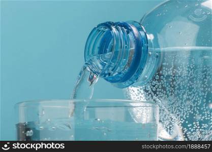 pouring sparkling water in cup . Resolution and high quality beautiful photo. pouring sparkling water in cup . High quality and resolution beautiful photo concept