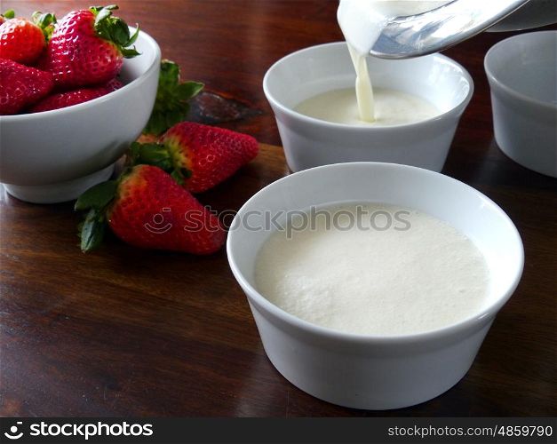 Pouring the panna cotta in small bowls. Panna Cotta preparation