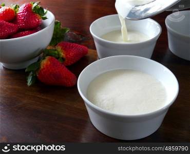 Pouring the panna cotta in small bowls. Panna Cotta preparation