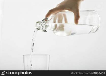 pouring water from bottle into glass . Resolution and high quality beautiful photo. pouring water from bottle into glass . High quality and resolution beautiful photo concept