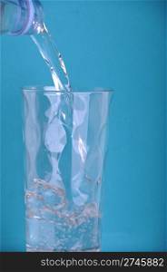 pouring water into a glass (blue background)
