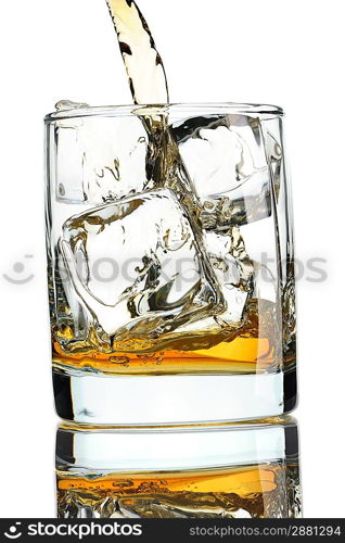 Pouring whiskey in glass with ice isolated on white