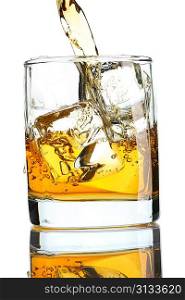 Pouring whiskey in glass with ice isolated on white