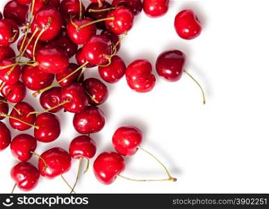 Pours pile of juicy sweet cherries isolated on white background