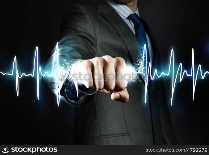 Power and control. Close up of businessman hand clenching graph in fist