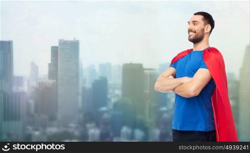 power and people concept - happy man in red superhero cape over singapore city skyscrapers background. happy man in red superhero cape over city
