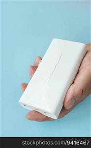 Power bank in hand, a battery that has become unusable, expands and swells until the case breaks. There is a risk of explosion. Power bank in hand, a battery that has become unusable, expands and swells until the case breaks. There is a risk of explosion.