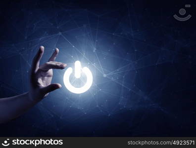 Power icon on digital background. Hand of man taking with fingers digital power icon