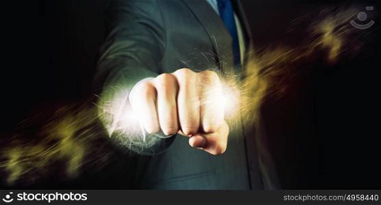 Power in hands. Businessman holding lightning in fist. Power and control