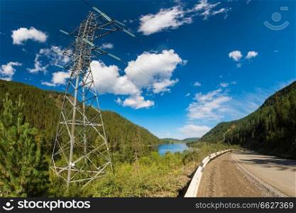 Power line in summer mountain in Altai. Power line in summer mountain