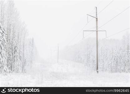 power line in the forest. Winter