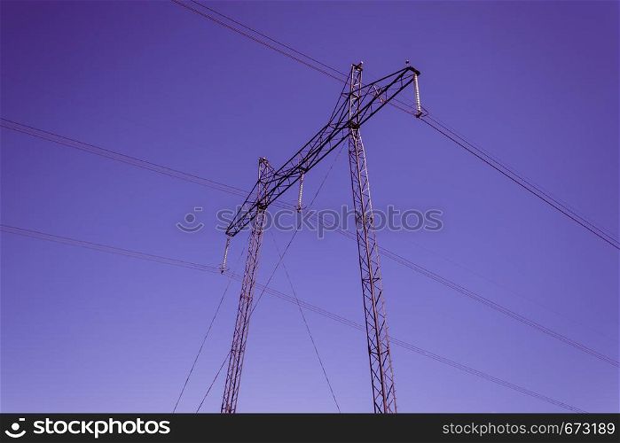 Power line on background of lilac sky. Electricity and energy transportation industry
