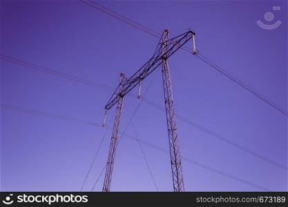Power line on background of lilac sky. Electricity and energy transportation industry