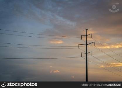 power line silhouette against sunset sky