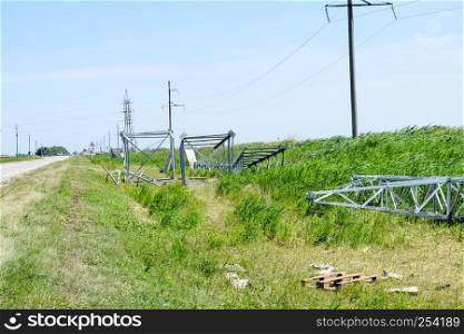 Power line support, insulators and wires. Appearance of a design. Assembly and installation of new support and wires of a power line.. Assembly and installation of new support of a power line