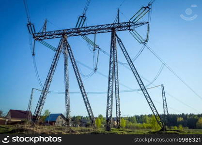 Power line supports. Electricity transmission and posts.. Power line supports. Electricity transmission