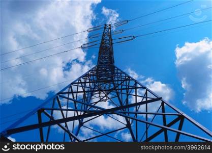 Power line tower on blue sky background. Power line tower