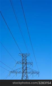 Power lines against blue sky.