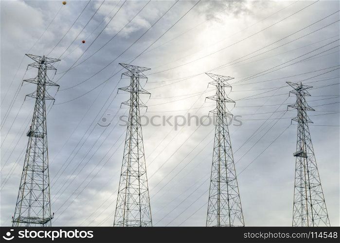 power lines and pylons against cloud sky near Kentucky Dam and power plant