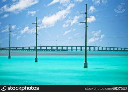 Power lines over turquoise sea in Florida Keys, south Florida, United States of America