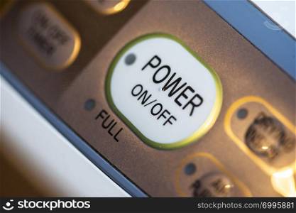 Power on button on electrical device. Close up button. Switch on/off conception.