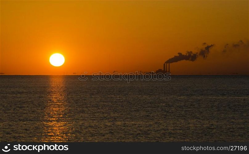 Power plant generating energy in the earily morning with pollution