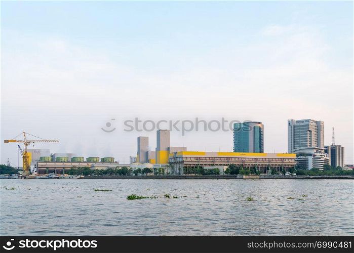 Power plant in Bangkok city. Power plant near river and in city.