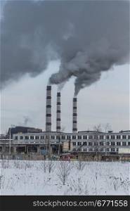 Power plant pollutes the environment, winter shot