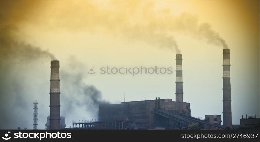 Power plant with yellow smoke
